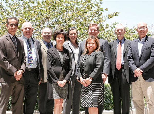 USC Norris medical leaders joined other faculty and staff in June to finalize preparations for the NCI site review. From left, Preet Chaudhary, Stuart Siegel, Heinz-Josef Lenz, Amy S. Lee, Roxana E. Bellia, Stephen B. Gruber, Janet L. Villarmia, Graham Casey and Alan S. Wayne.