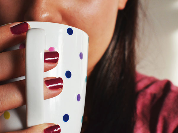 woman smelling coffee