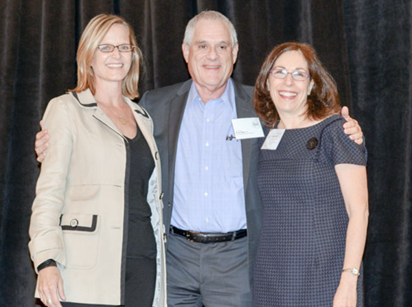 Stuart Siegel with Heidi Adams, CEO of Critical Mass, and Lauren Berger from the Leukemia & Lymphoma Society, which sponsored the award.