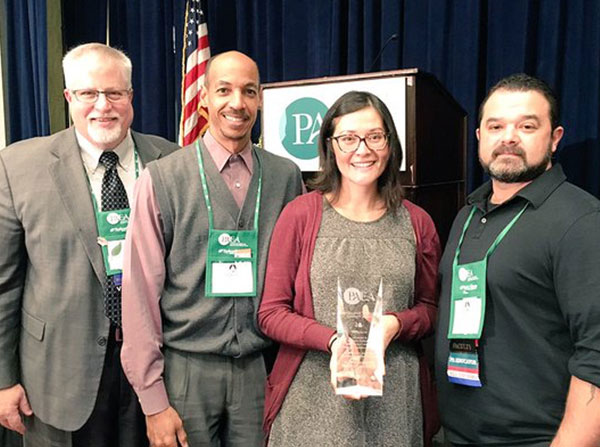 Maria Maldonado, instructor of clinical family medicine, holds the Excellence Through Diversity Award presented in November to the Primary Care Physician Assistant Program at Keck Medicine of USC.