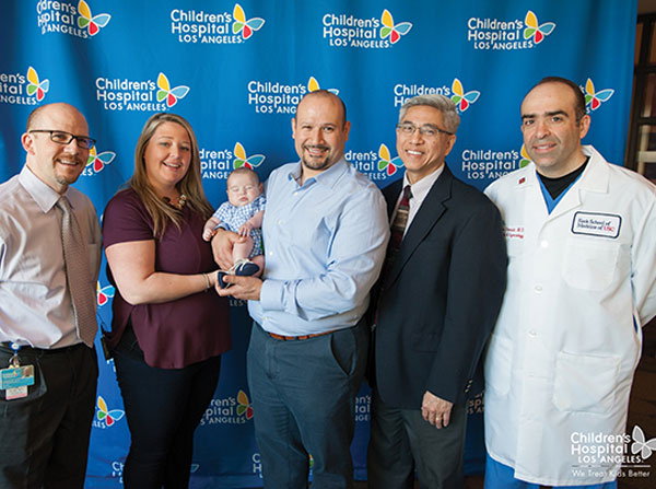 From left, Jay Pruetz, Samantha Davila, Grayson Davila, Marco Davila, Frank Ing and Ramen Chmait pose at Children's Hospital Los Angeles.