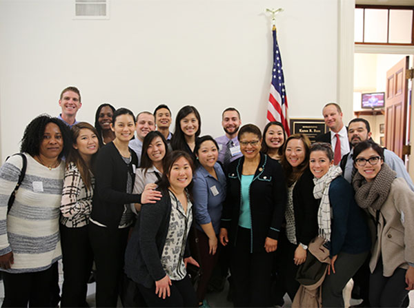 Students pose with Congresswoman Karen Bass, an alumni of the Primary Care Physician Assistant Program at the Keck School of Medicine of USC, in front of her office on Capitol Hill.