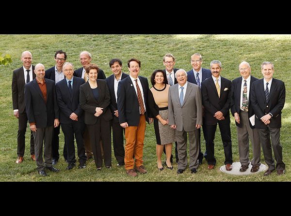 Speakers and session chairpersons stand with Berislav Zlokovic, eighth from left, and Selim Zilkha, fifth from right, during the third annual Zilkha Symposium on Alzheimer Disease and Related Disorders, held April 15 on the Health Sciences Campus.