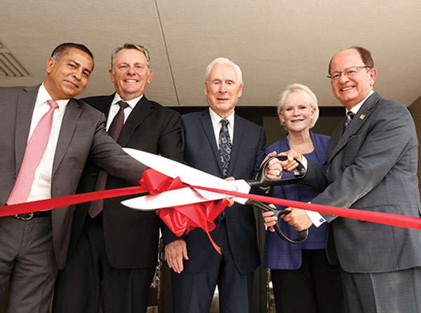 From left, Keck School of Medicine of USC Interim Dean Rohit Varma, USC Board of Trustees Chairman John Mork, philanthropists Malcolm and Barbara Currie, and USC President C. L. Max Nikias are seen during a ribbon-cutting ceremony for the Malcolm and Barbara Currie Residence Hall, held Aug. 25 on the Health Sciences Campus.