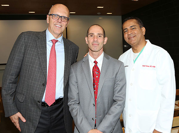 Tom Jackiewicz, Steven Siegel and Rohit Varma are seen during the welcome reception for Siegel, held Sept. 14 on the Health Sciences Campus.