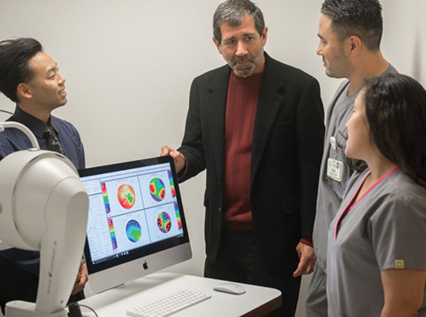 Joseph Cocozza, second from left, is leading the establishment of an ophthalmic technician training program at the USC Gayle and Edward Roski Eye Institute. Pictured with him are Ray Yamamoto, left; Ryan Imagiire, second from right; and Liz Capati, right