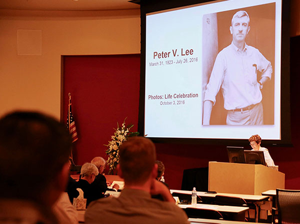 Department of Family Medicine Chair Laura Mosqueda speaks at a memorial service for Peter V. Lee, held Oct. 3 at Aresty Auditorium.