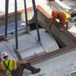 Construction workers lowers the 7T MRI