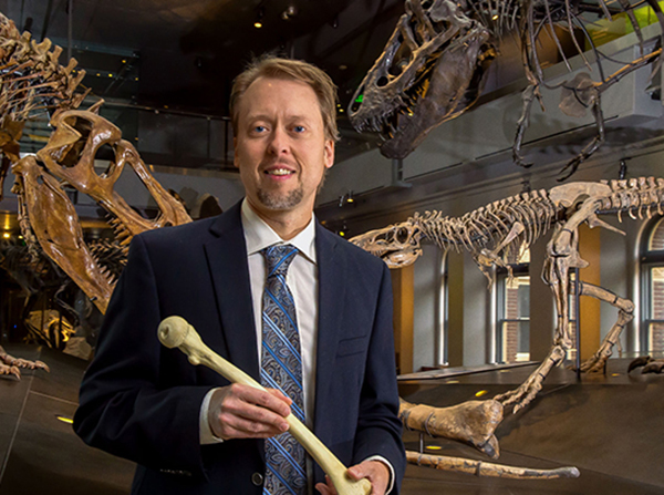 Biological anthropologist Kristian J. Carlson, USC associate professor of Clinical Integrative Anatomical Sciences. Kristian studies organism's bones to figure out how they lived and died. Poses for photograph at the Los Angeles Museum of Natural History, Tuesday, March 13, 2018.  (Photo/Gus Ruelas)