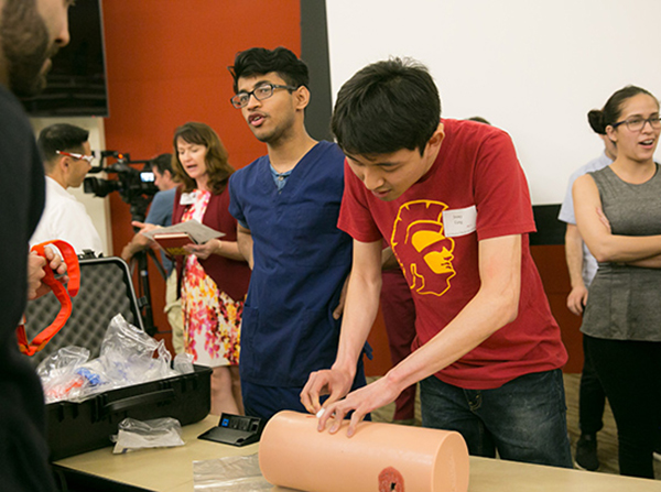 First-year medical student Jeremy Uang participates in a Stop the Bleed event on March 30