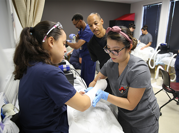 Clinical instructor oversees a cast workshop in the Primary Care Physician Assistant Program at the Keck School of Medicine of USC.