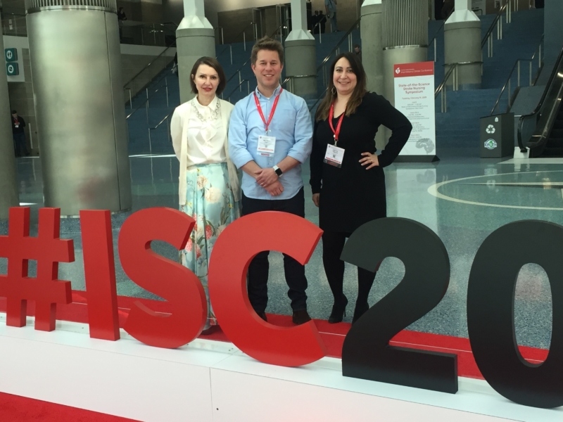 People standing behind an #ISC2020 sign - 3