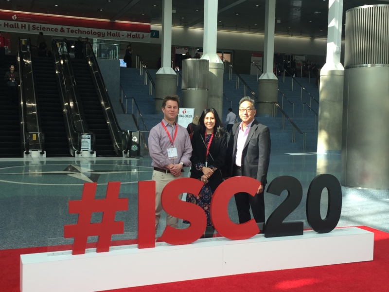 People standing behind an #ISC2020 sign - 4