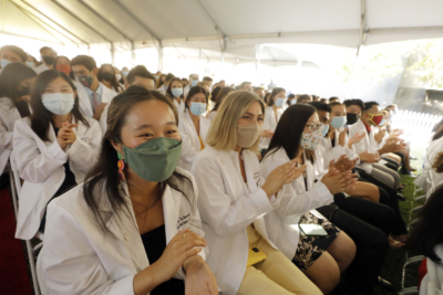 First-year MD candidates cheer during the White Coat ceremony on the Health Sciences Campus at the Keck School, Aug. 6, 2021.