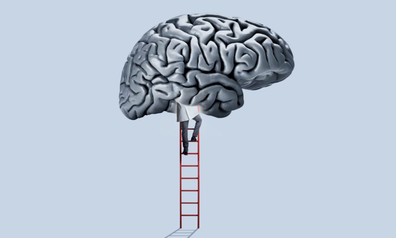 A doctor wearing a white doctor's coat climbs a red ladder as he enters a large human brain that hovers above him.