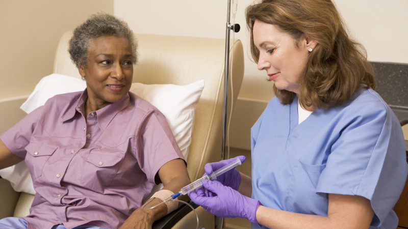 Nurse providing care to an elderly patient