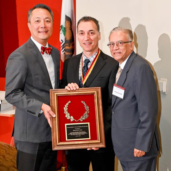 Dr. Dean Eliott (center) receives the Narsing A. Rao, MD Endowed Lecture Award from Drs. J. Martin Heur (left) and Narsing Rao (right). (Photo/Filgraphix)