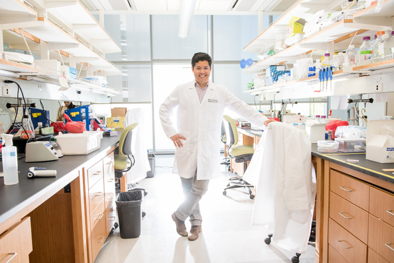 Justin Ichida, PhD, standing in a laboratory